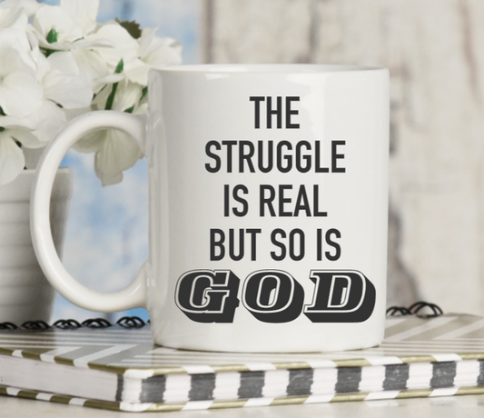 The Struggle is Real but so is God mug
